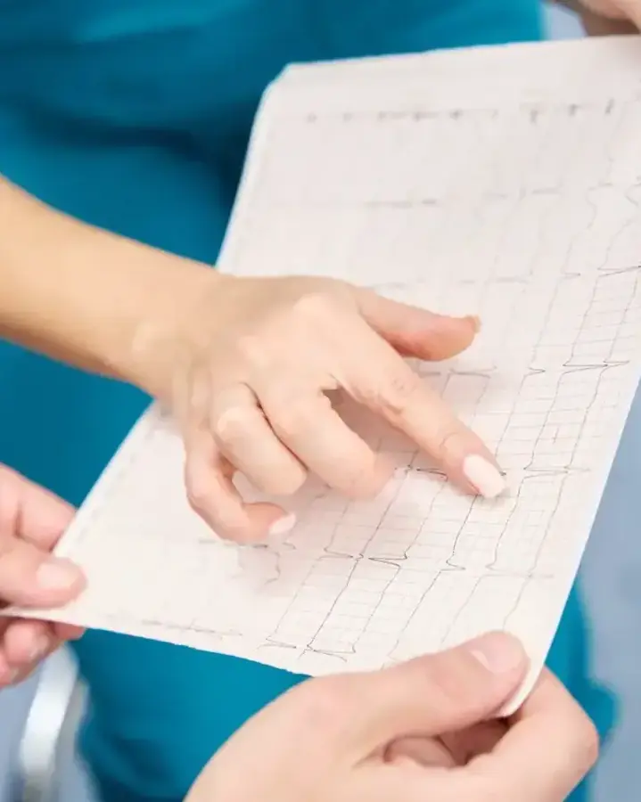 nurse showing patient info on paper
