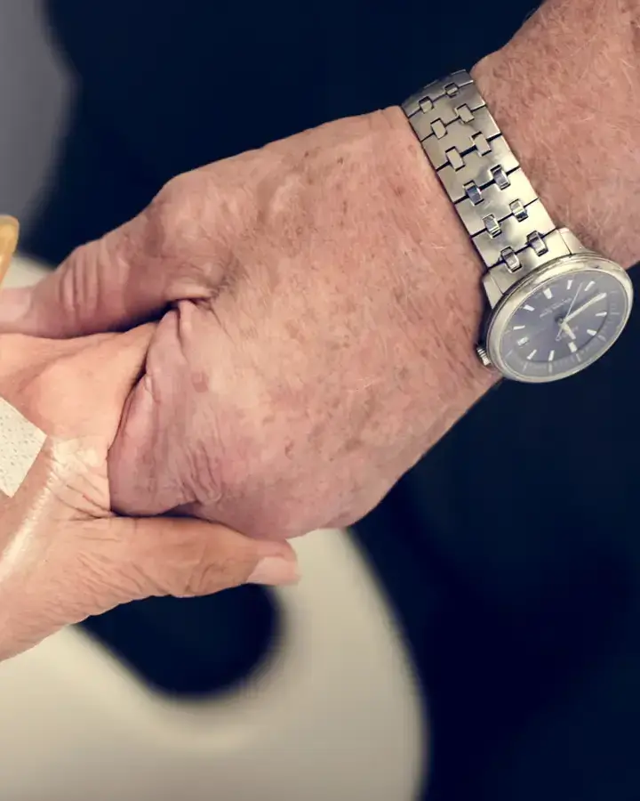 a person is putting a bandage to another person