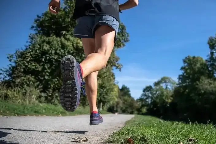 a woman running on a path