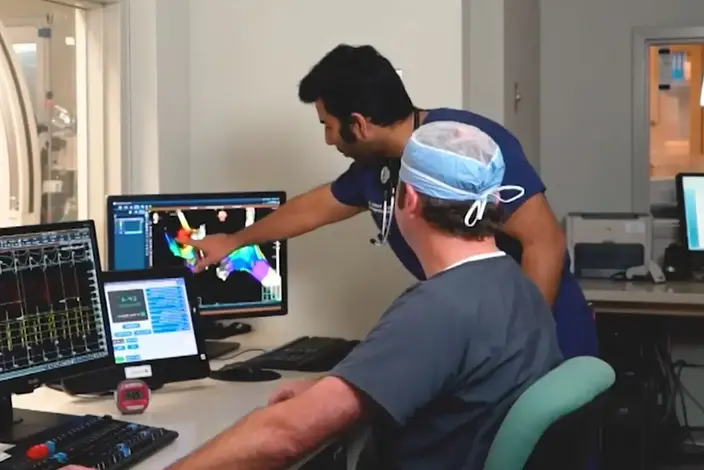 two-men-looking-at-scan-results