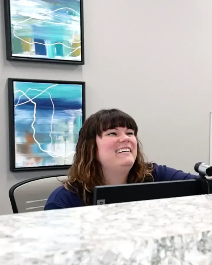 reception desk with staff and patient