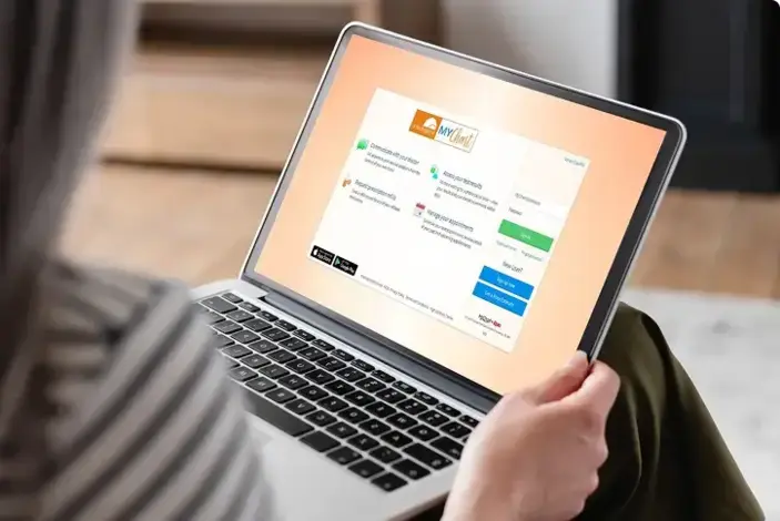Person logging into MyChart on their laptop