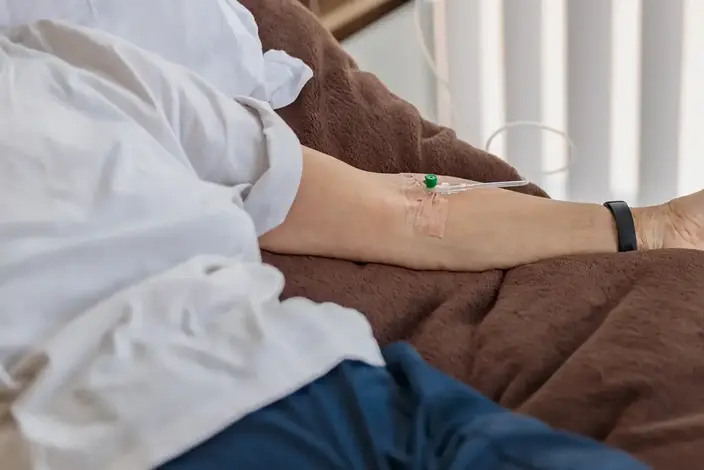 a nurse is checking the blood of a patient