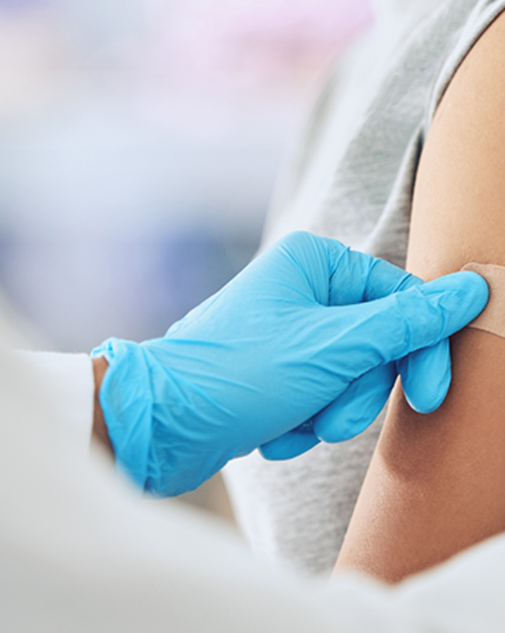 adult-getting-bandage-after-vaccine-in-clinic