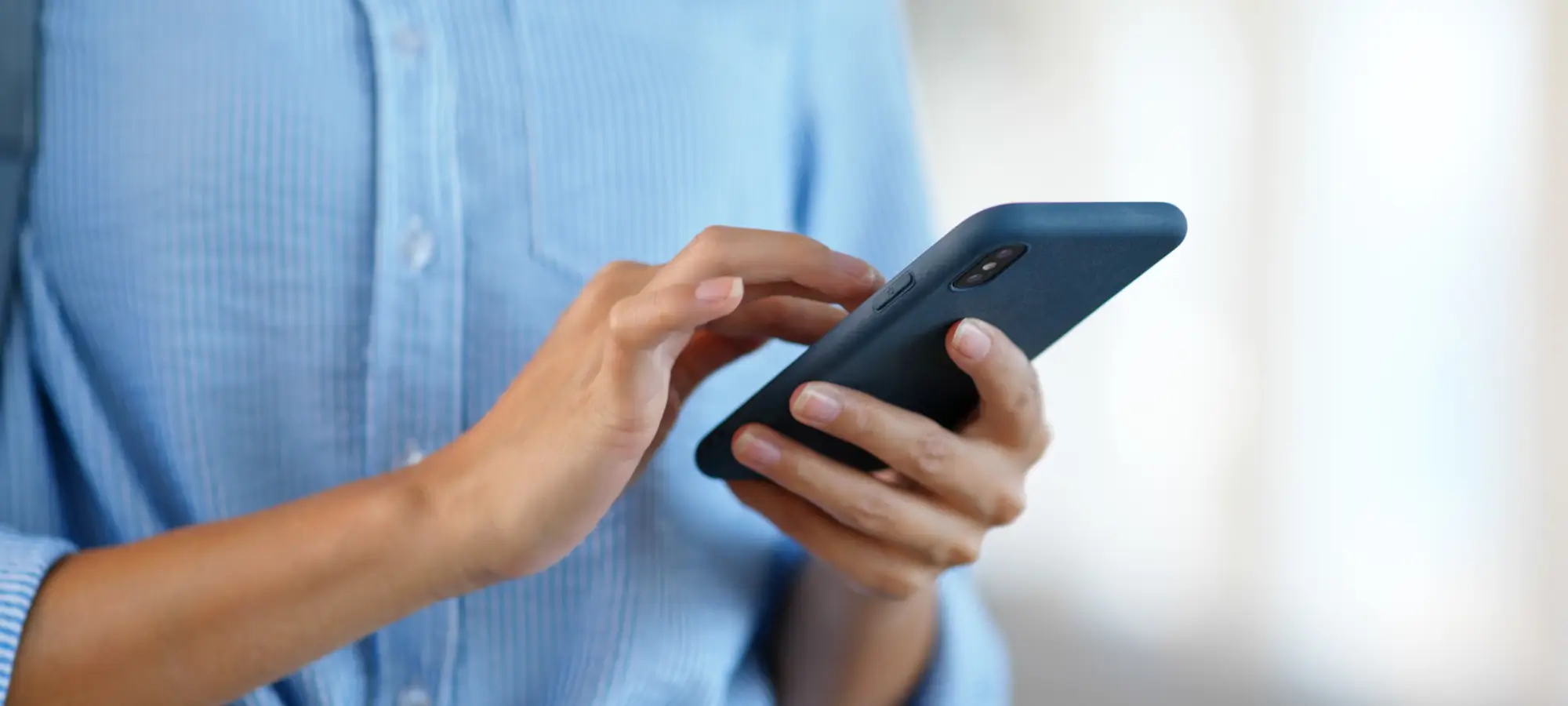 a woman using her phone 