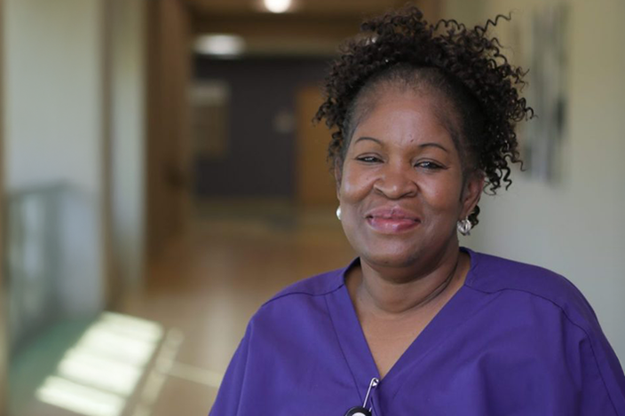 A-service-worker-standing-in-a-hallway