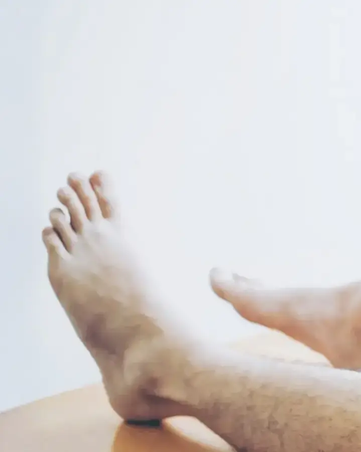 man on table getting leg exam